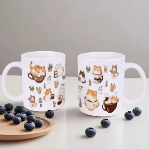 Cute Cats and Potted Plants In White Ceramic Teacup